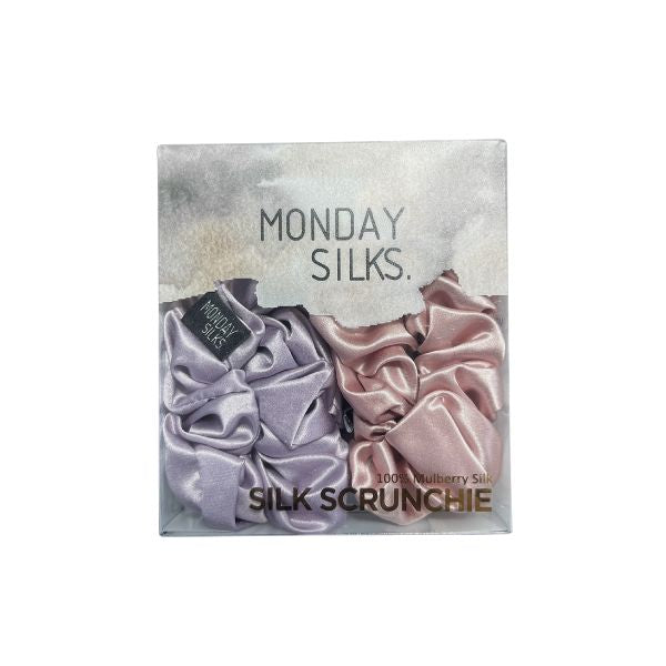 Box of Monday Silks silk scrunchies with two scrunchies inside, lilac and pink