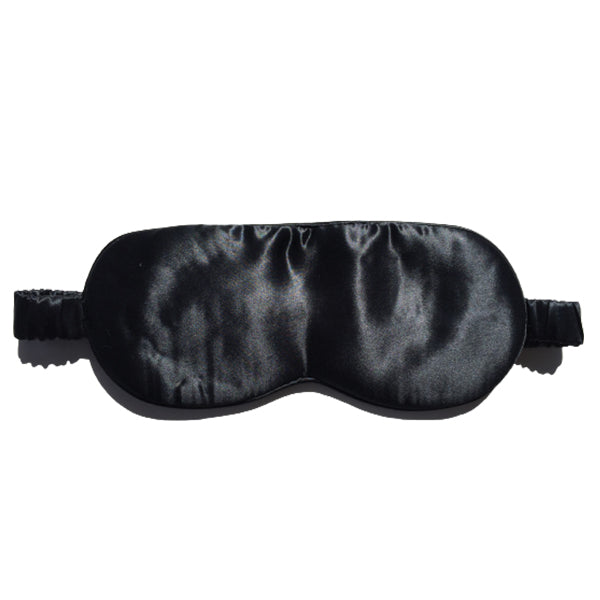 Black silk eye mask by Monday Silks, designed for restful sleep and reduced skin friction. Soft and breathable sleep accessory.