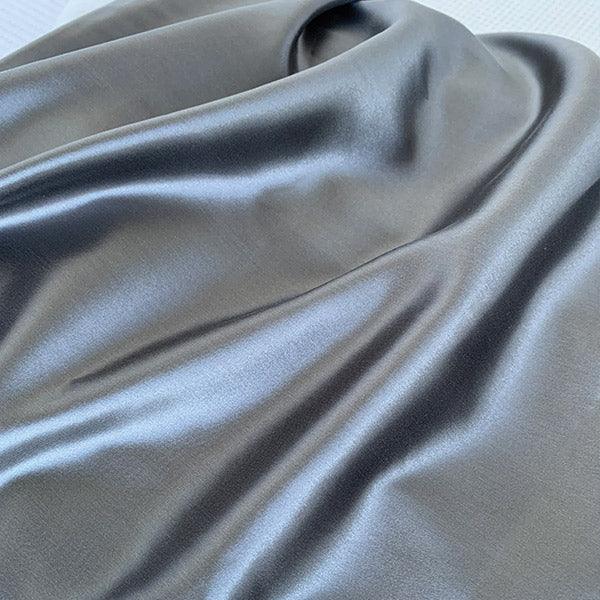 Charcoal silk pillowcase by Monday Silks NZ featuring smooth, glossy mulberry silk fabric ideal for reducing bed hair and maintaining skin hydration.