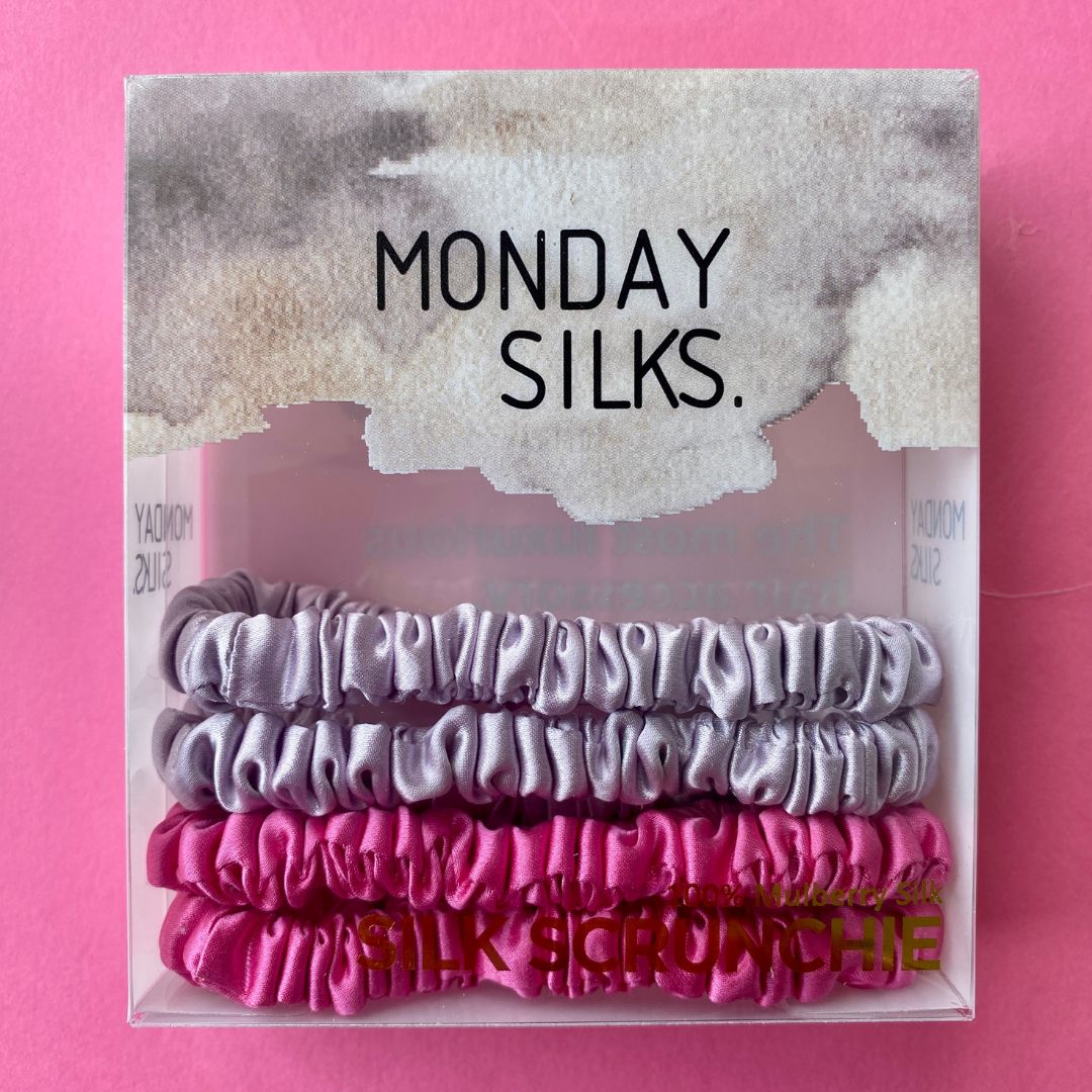 Skinny Silk Scrunchies - 4 Pack (2 x Fuchsia, 2 x Lilac) in clear box packaging labeled Monday Silks, ideal for frizz-free hair styling.