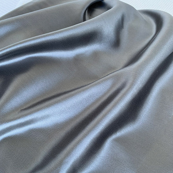Charcoal silk pillowcase by Monday Silks NZ featuring smooth, glossy mulberry silk fabric ideal for reducing bed hair and maintaining skin hydration.